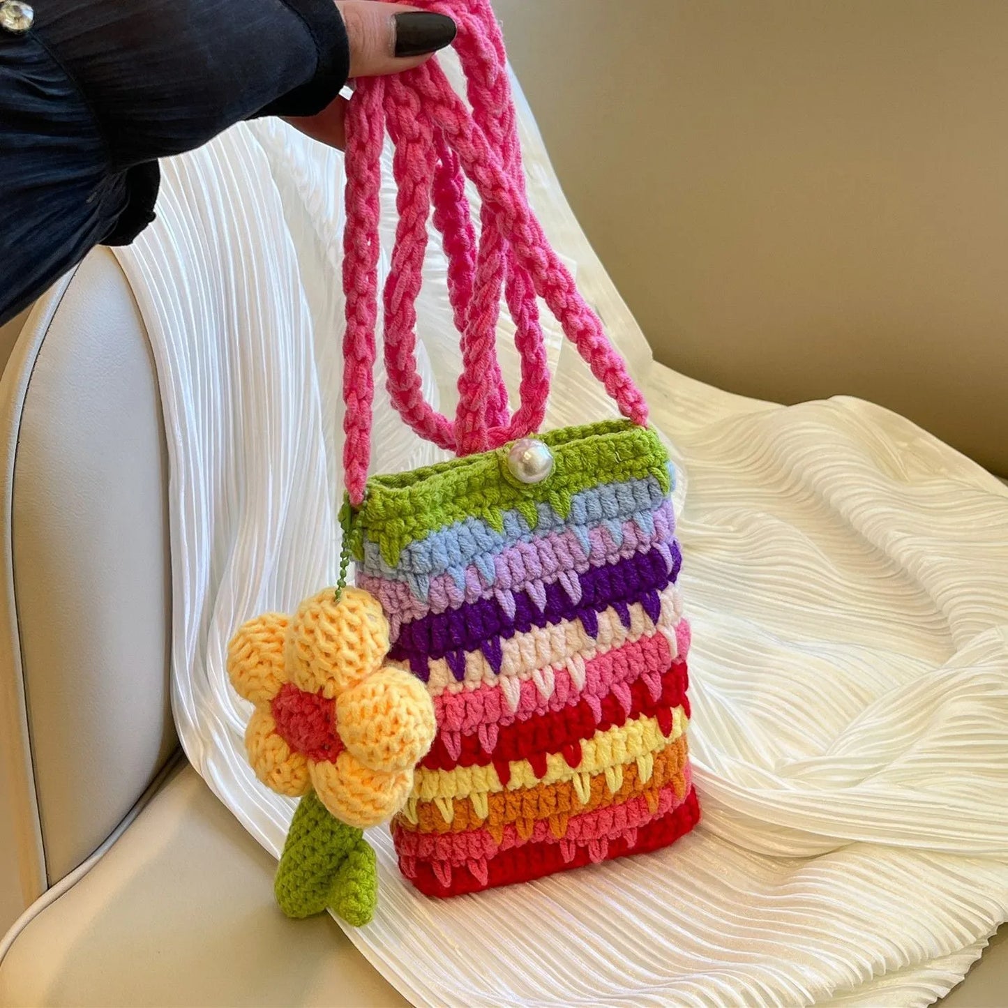 Soft plush mobile phone shoulder bag with floral pendant charm in red or pink flowers.