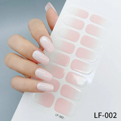 Sheet of 16 small design nail art stickers including cross, rose, tulip and marble patterns.