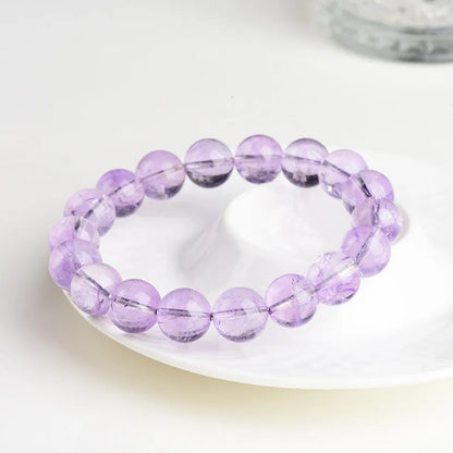 Lavender amethyst bracelet with water ripple geometric beads in various sizes on wrist