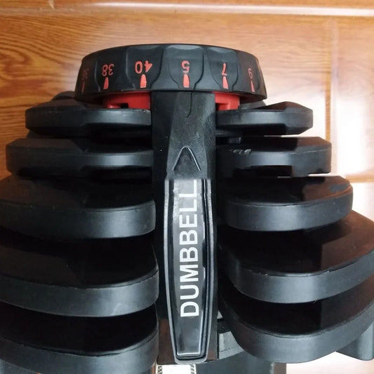 Black automatic adjustable dumbbell with dial weight selector showing 5-25kg range