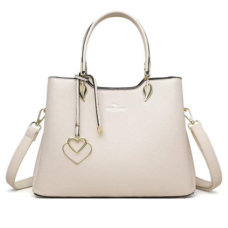 Women's black PU leather messenger bag with multi-layer shoulder strap and sewing thread detailing.