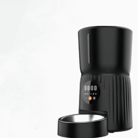 Black intelligent pet feeder with transparent food container showing kibble, digital display, and USB power cable
