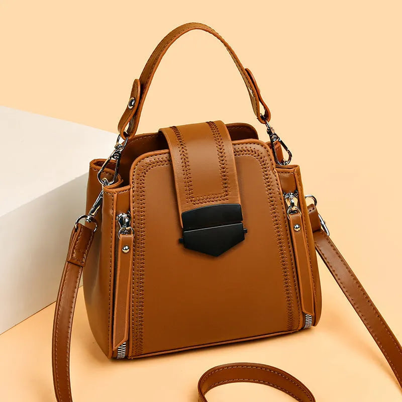 Soft PU leather ladies handbag with textured surface and sewing thread detailing in square vertical shape