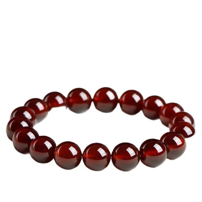 Natural orange red garnet crystal ball bracelet with traditional Ruyi design elements and adjustable bead sizing