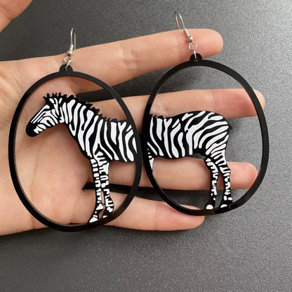 Black acrylic dangle earrings featuring unique animal and zodiac designs, lightweight and stylish.