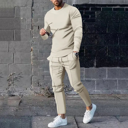 Men's light grey polyester two-piece suit set with long sleeve round neck T-shirt and matching trousers.
