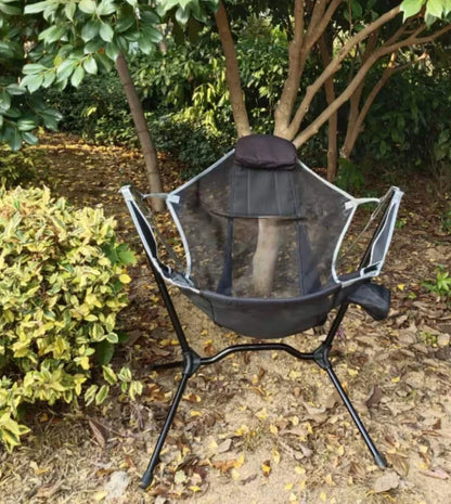 Green outdoor folding rocking chair with aluminium frame in unfolded position