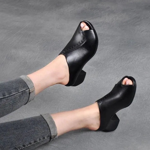 Women's black square heel peep toe slippers with a fish mouth scaffold design and rubber sole.