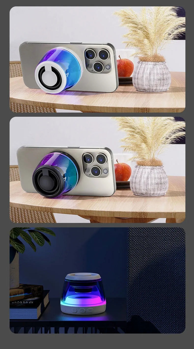 Small white portable Bluetooth speaker with LED light glow on a wooden desk next to a smartphone.