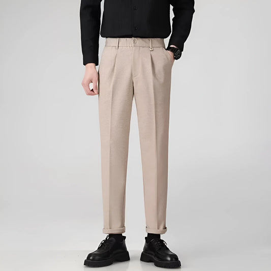 Man wearing straight cut draped polyester casual trousers in dark grey