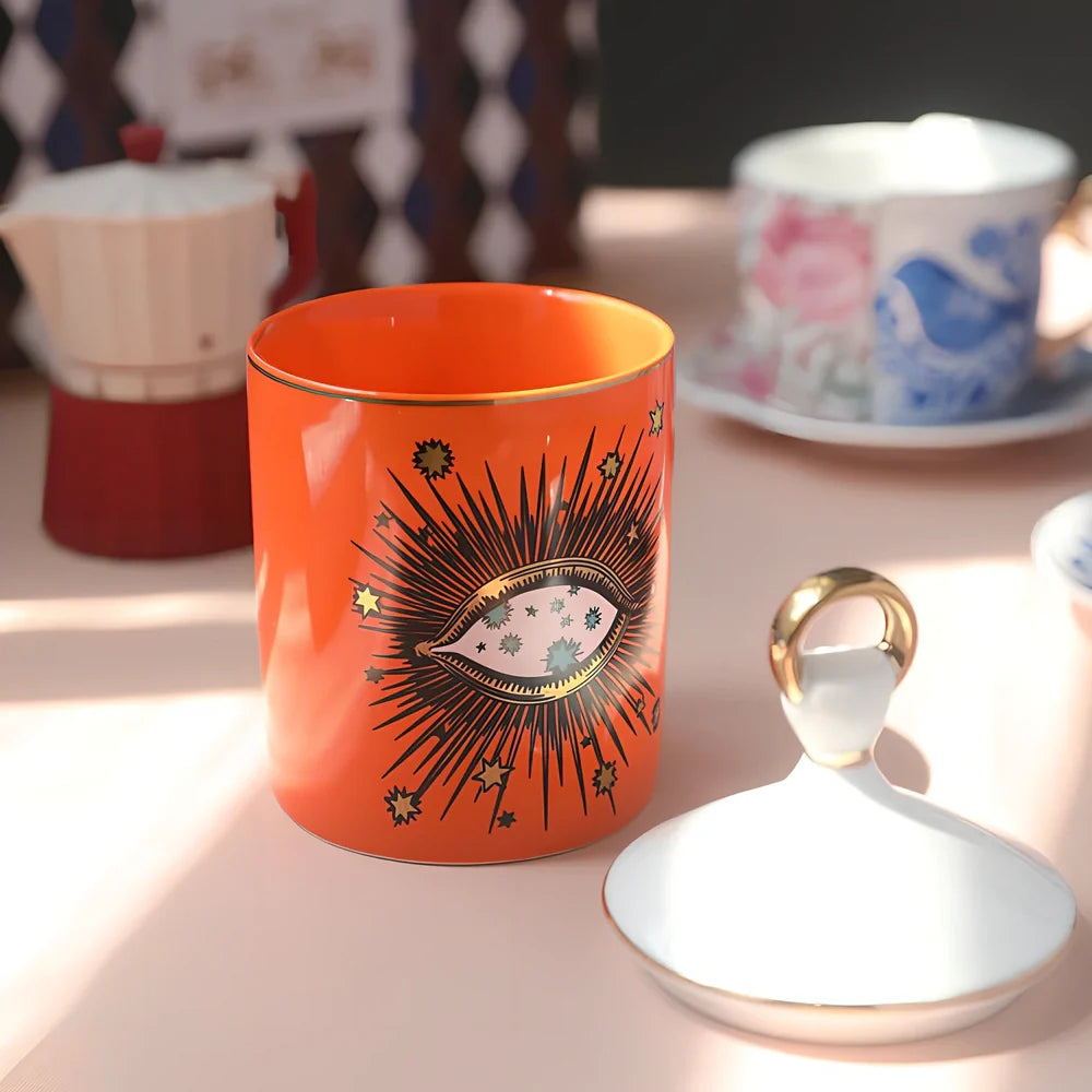 Blue ceramic candle holder with figure decals measuring 15cm high