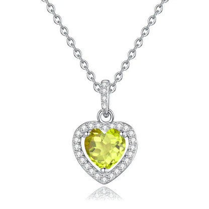 Sterling silver heart pendant necklace with a coloured gemstone on an adjustable chain.
