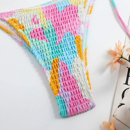 Women's triangle bag bikini swimsuit with floral gradient print and smocking craft detail