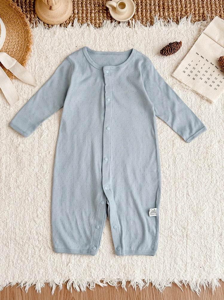 Pure cotton baby romper in blue with long sleeves and single-breasted closure, showing long climbing style design