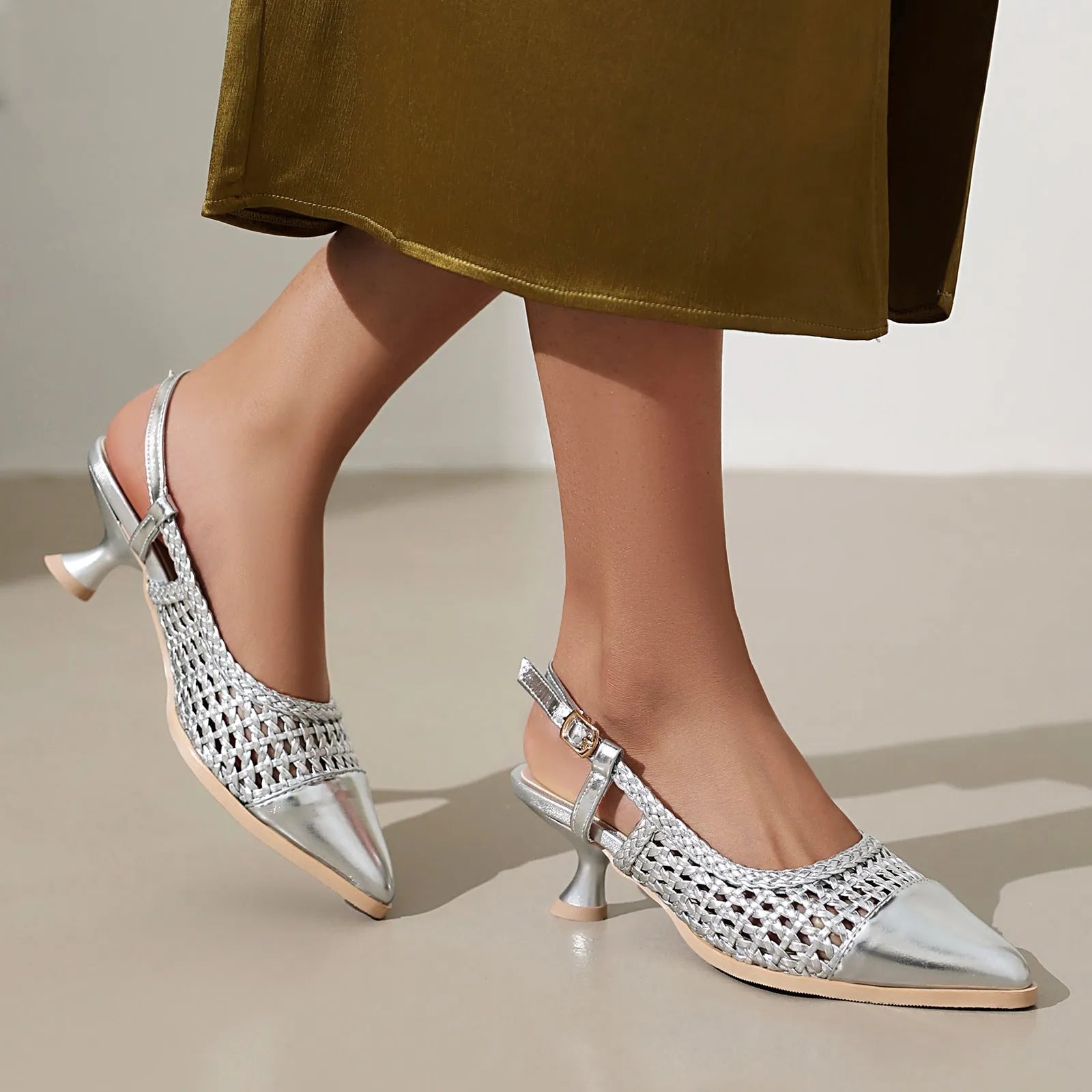 Gold women's professional sandals with a cat heel, pointed toe, and ankle buckle strap.
