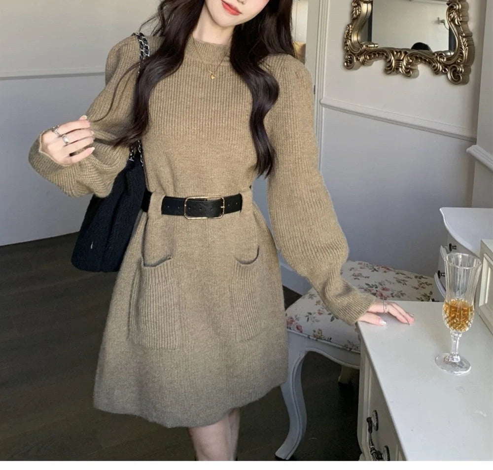Women's long sleeve loose knitted dress in beige with black belt, showing high waist design and free size fit