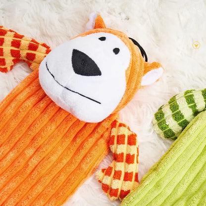 Green and orange plush dog toy with a squeaker for aggressive chewers.