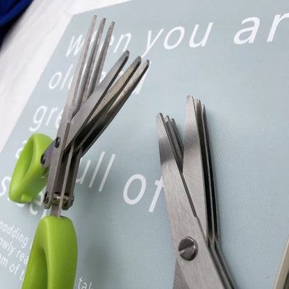 Green stainless steel multi-layer V-shaped kitchen scissors for cutting onions and herbs.