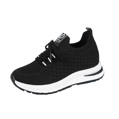 Women's black mesh lace-up platform sneakers with a round toe and flat rubber sole on a white background.