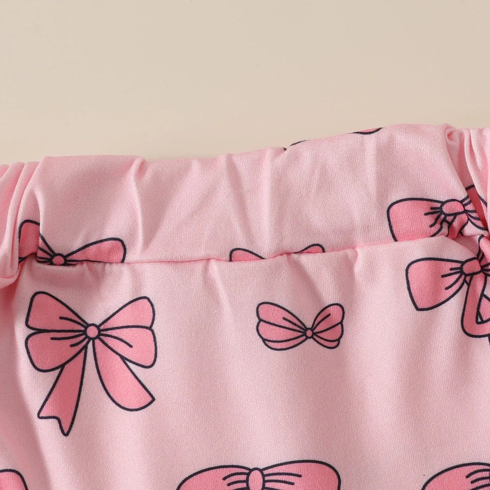 Girls' pink cotton romper and shorts two-piece set with included hair accessory