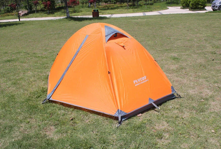 Double layer rainproof camping tent in green, orange, and blue colors for high altitude adventures