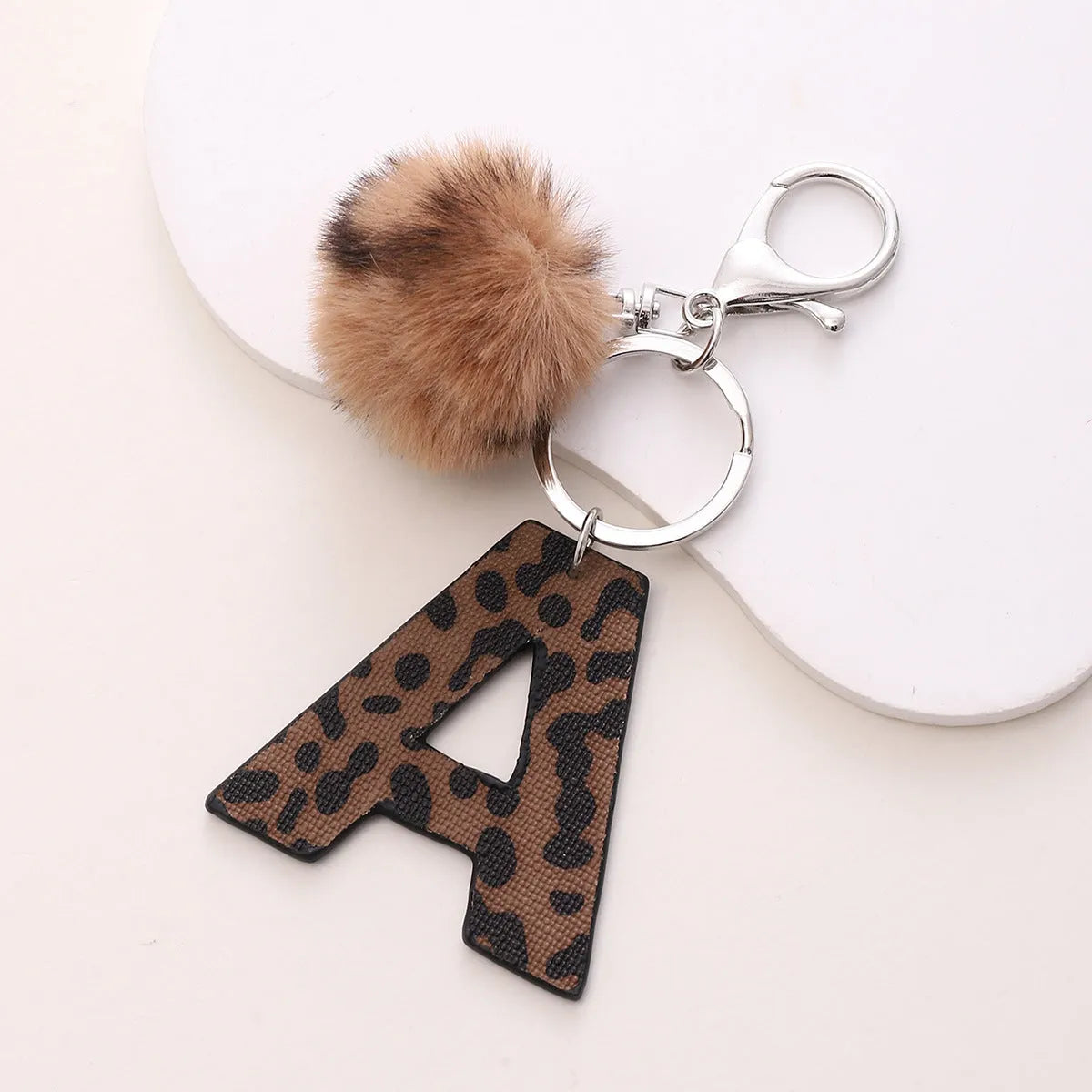 Leopard-print artificial leather keychain with oil-edged acrylic letter and included key ring, retro style