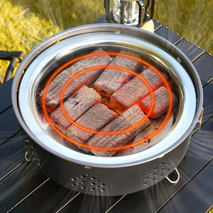 Detachable stainless steel portable barbecue grill with storage bag, shown assembled for outdoor use.