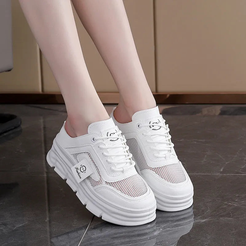 Women's black mesh half slipper with round toe and rubber sole, shown on a white background.