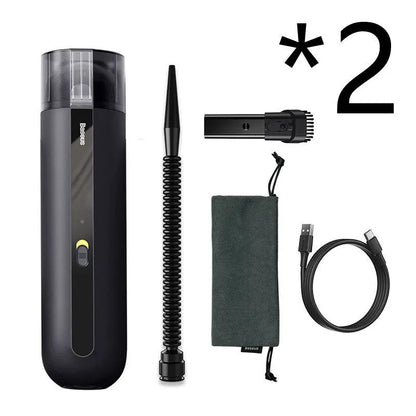 BASEUS handheld car vacuum cleaner in black with blowing hose attachment, showing compact size and dust bin