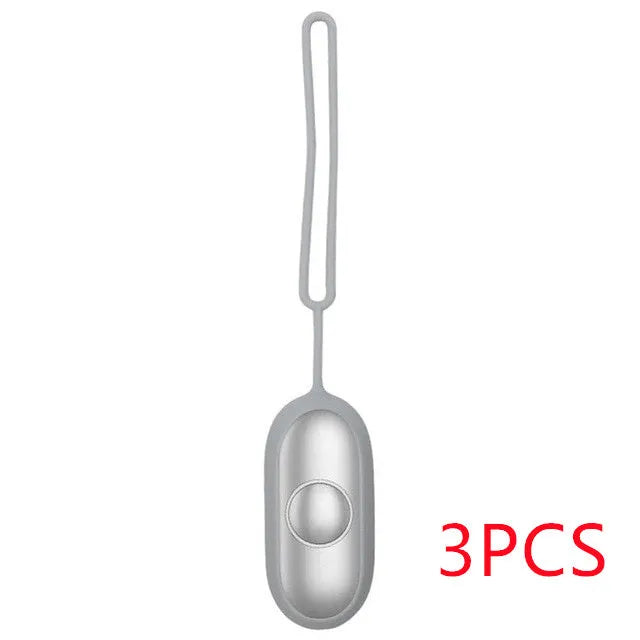 Hand-held micro-current sleep aid device in grey, green, and orange colour options