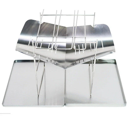 Portable folding outdoor camping stove with grill, made of titanium and stainless steel for durable and versatile outdoor cooking