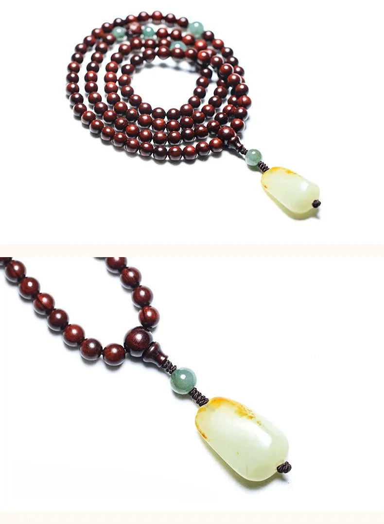 Rosewood bead bracelet with a carved wooden 108 bead and a green Hotian jade pendant on a neutral background.
