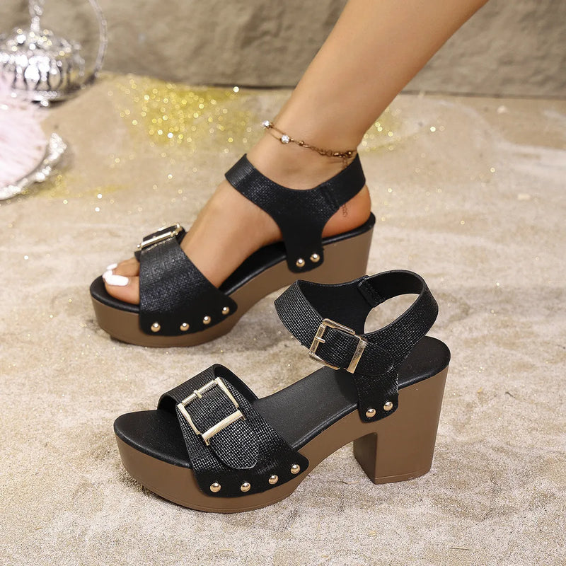 Plus size high heel sandals with thick block heel, buckle fastening, and rivet buckle details in fish mouth toe style, available in black, brown, and beige colours with rubber soles for everyday summer wear.