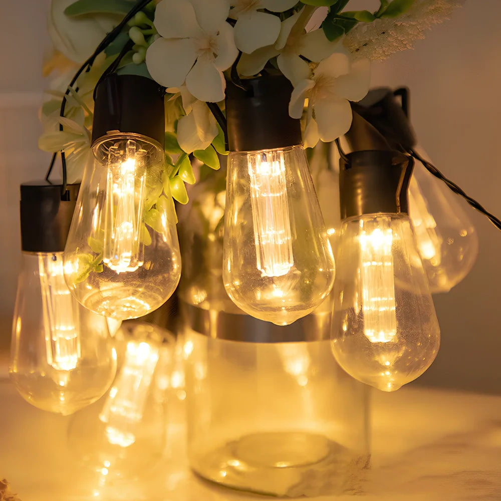 Solar water drop bulb lantern with LED lights in garden setting showing weather-resistant construction