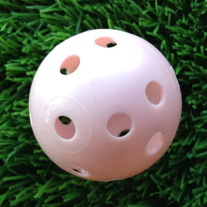 Hollow plastic golf practice balls in various colors for indoor use