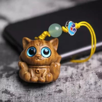 Handmade green sandalwood kitten ornament with unique design