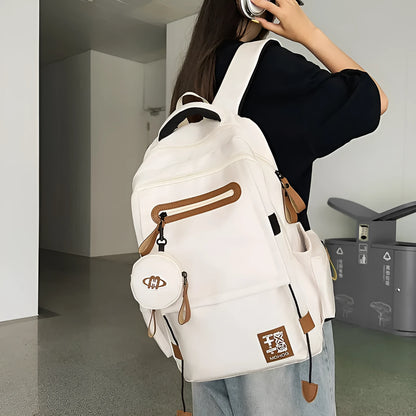 Large waterproof nylon travel backpack in blue with contrast stitching and 20-35 litre capacity