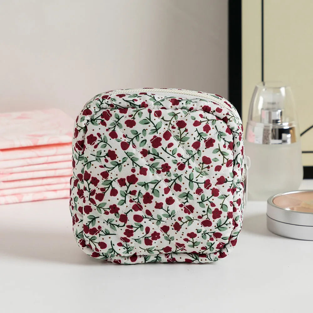 Women's key storage bag with floral patterns including cherry on white background design
