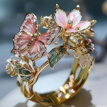 Adjustable crystal butterfly flower ring in gold, silver, and rose gold finishes