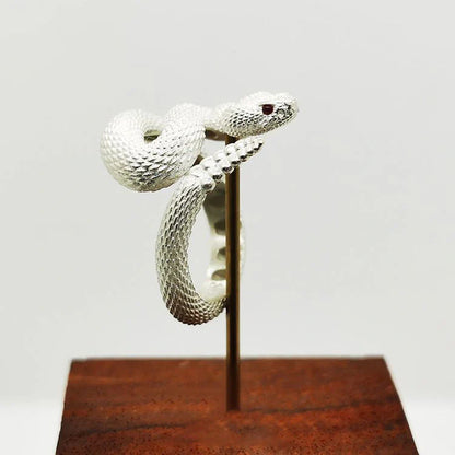 Adjustable snake ring with unique rattlesnake design in various color options, including white and black with open or shut mouth styles, and gold accents