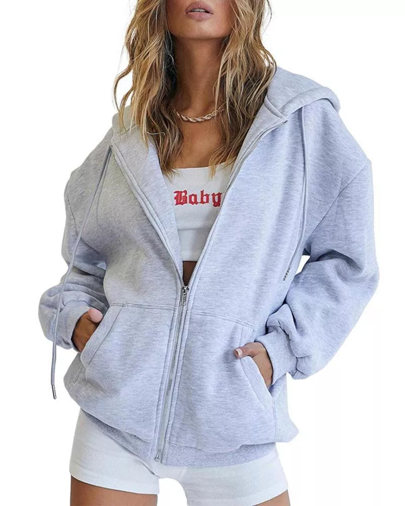 Women's solid color zipper hooded sweatshirt with drawstring, available in multiple colors and sizes.