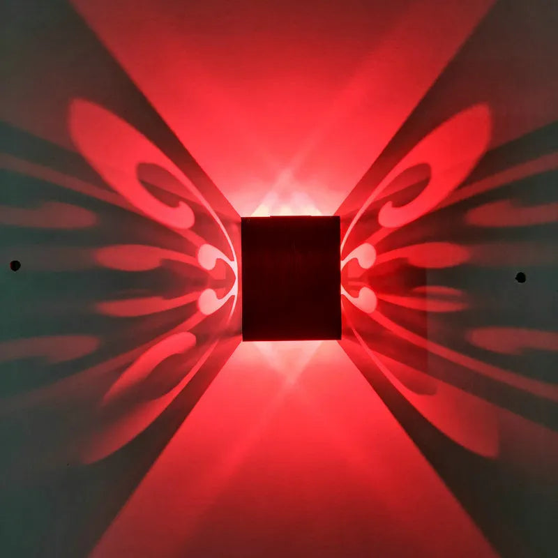 Modern aluminium butterfly-shaped LED wall lamp with remote control for colour changing.