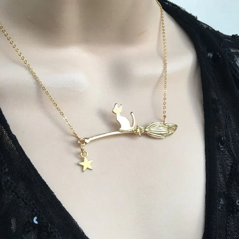 Black cat pendant necklace on a chain, available in silver and gold finishes.