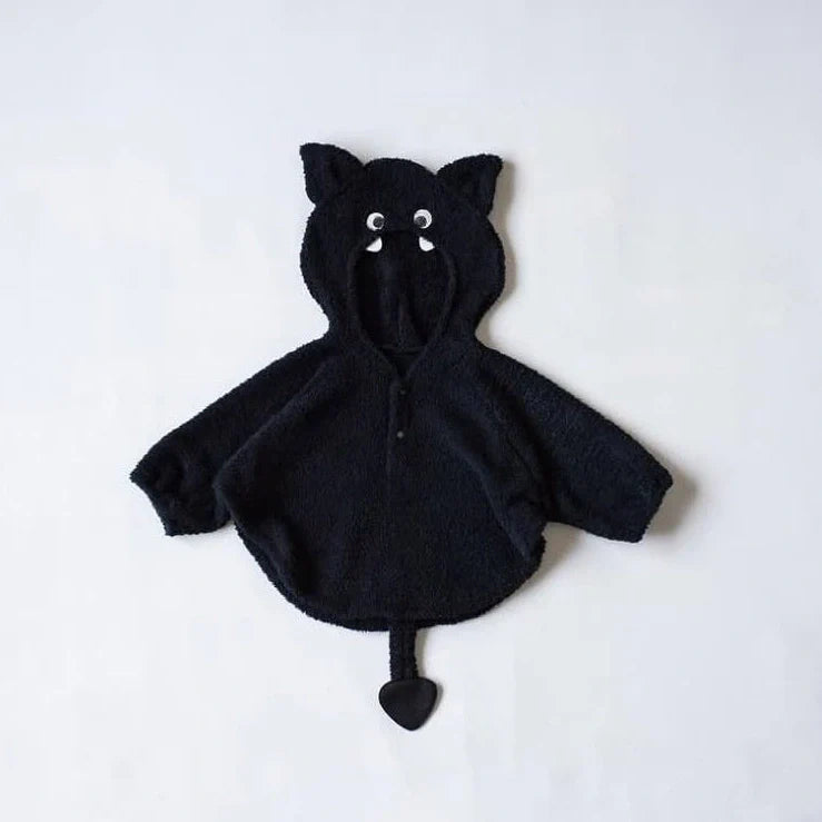 Baby wearing festival-themed plush top with hood and long sleeves in fleece fabric