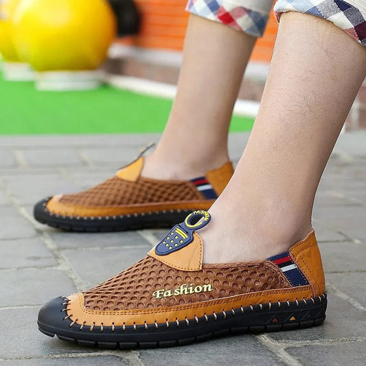 Men's brown mesh casual shoes with round toe and rubber sole, showing breathable design and low heel