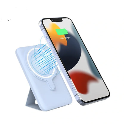 White Magsafe magnetic power bank showing magnetic charging side and USB ports