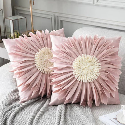 Stylish velvet throw pillows with 3D chrysanthemum embellishments in blue, yellow, pink, and white colors