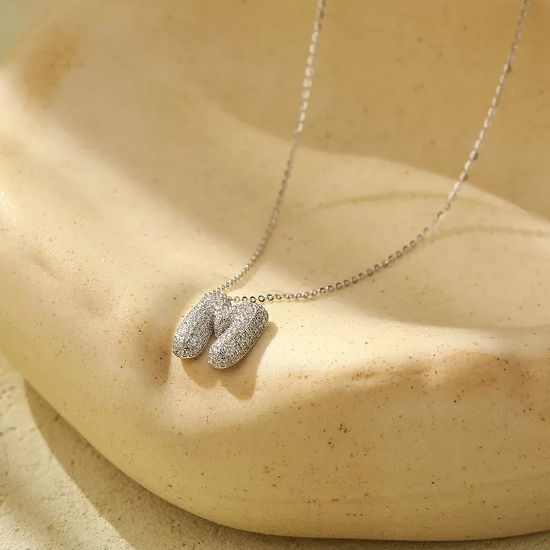 Stainless steel initial pendant necklace with zircon accents, personalized with your choice of letter.