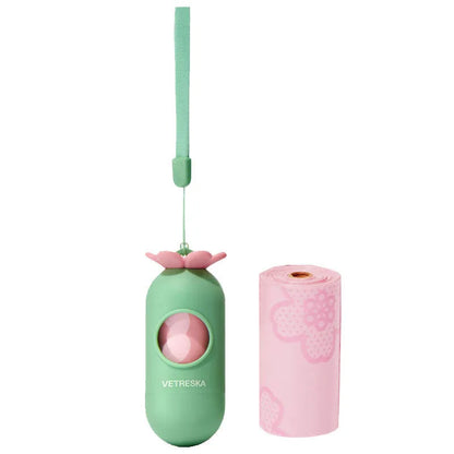 Plastic dog poop bag dispenser capsule clipped to a lead next to a roll of scented waste bags.