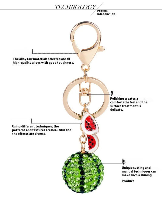 Green watermelon-shaped keychain in zinc alloy, 12cm long with metal attachment.